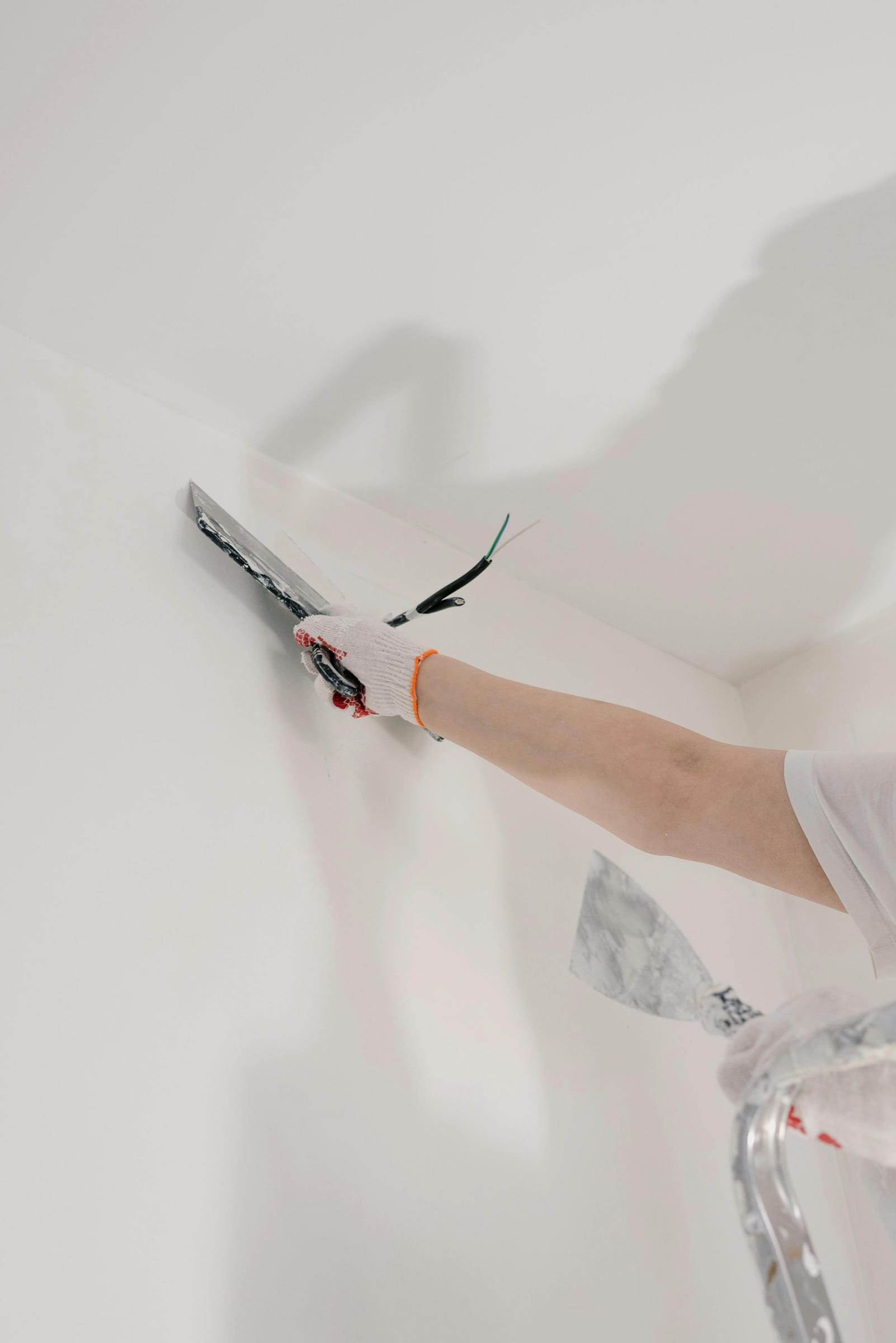 Drywall joint compound applied to a wall corner during a repair.